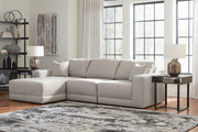 Ashley Furniture Next-Gen Gaucho sectional sofa with chaise, featuring plush cushions and modern design in a neutral fabric.