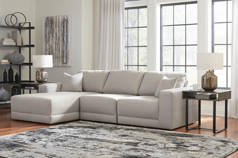 Ashley Furniture Next-Gen Gaucho sectional sofa with chaise, featuring plush cushions and modern design in a neutral fabric.
