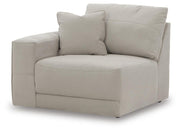 Ashley Furniture Next-Gen Gaucho sectional in a stylish fabric, shown from an angled view highlighting its modern design and spacious seating.