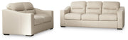 Ashley Furniture Treasure Trove living room set with sofa, loveseat, and armchair in a cozy, stylish living space.