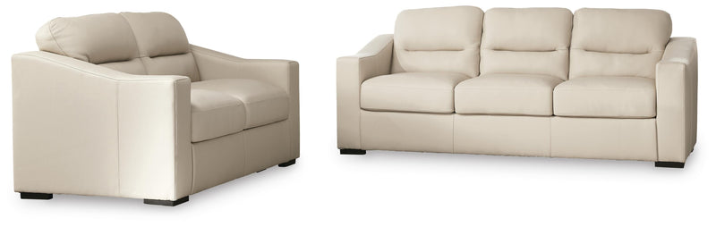 Ashley Furniture Treasure Trove living room set with sofa, loveseat, and armchair in a cozy, stylish living space.