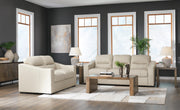 Ashley Furniture Treasure Trove living room set with plush sofa and matching armchair in a cozy, stylish living space.