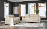 Ashley Furniture Treasure Trove living room set with sofa, armchair, and coffee table in a cozy, modern design.