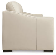 Ashley Furniture Treasure Trove sofa featuring plush cushions and modern design, shown from a side view.