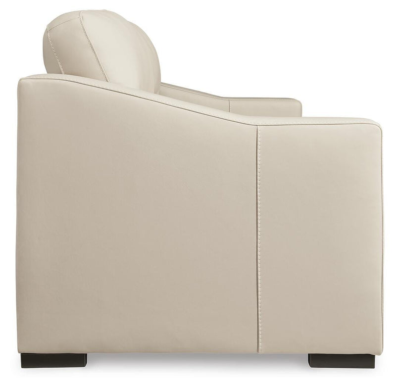 Ashley Furniture Treasure Trove sofa featuring plush cushions and modern design, shown from a side view.