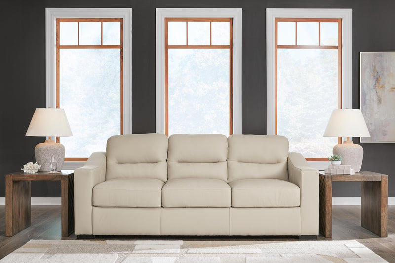 Ashley Furniture Treasure Trove sofa with plush cushions and textured fabric, showcasing a stylish living room setup.