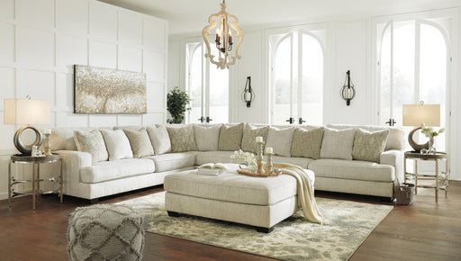Ashley Furniture Rawcliffe Living Room Set featuring a sofa and armchair with neutral upholstery and modern design.