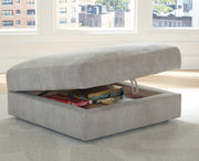 Open Ashley Furniture Aslan Court Ottoman with storage, showing plush upholstered top and spacious interior for versatile use.