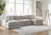 Ashley Furniture Aslan Court sectional sofa pit section with plush cushions and modern design, shown in a spacious living room setting