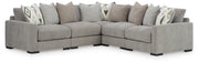 Ashley Furniture Aslan Court sectional sofa with plush cushions and neutral fabric, shown in a modern living room setting.