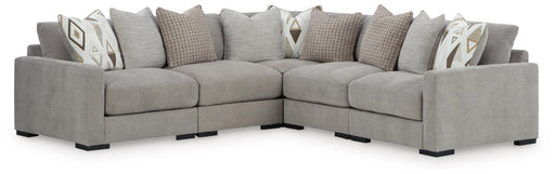 Ashley Furniture Aslan Court sectional sofa with plush cushions and neutral fabric, shown in a modern living room setting.