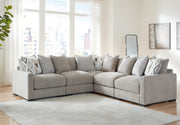 Ashley Furniture Aslan Court sectional with plush fabric upholstery, featuring multiple seating sections and modern design.