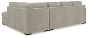 Ashley Furniture Calnita sectional with chaise, showing plush fabric upholstery and supportive cushions in a stylish living room setting.