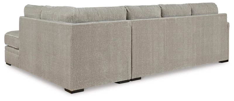 Ashley Furniture Calnita sectional with chaise, showing plush fabric upholstery and supportive cushions in a stylish living room setting.