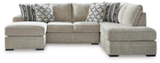 Ashley Furniture Calnita sectional with chaise showing plush fabric upholstery and modern design in a spacious living room setting.