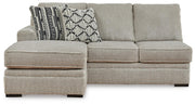 Ashley Furniture Calnita sectional with chaise, beige fabric, featuring plush cushions and a modern design, front view.