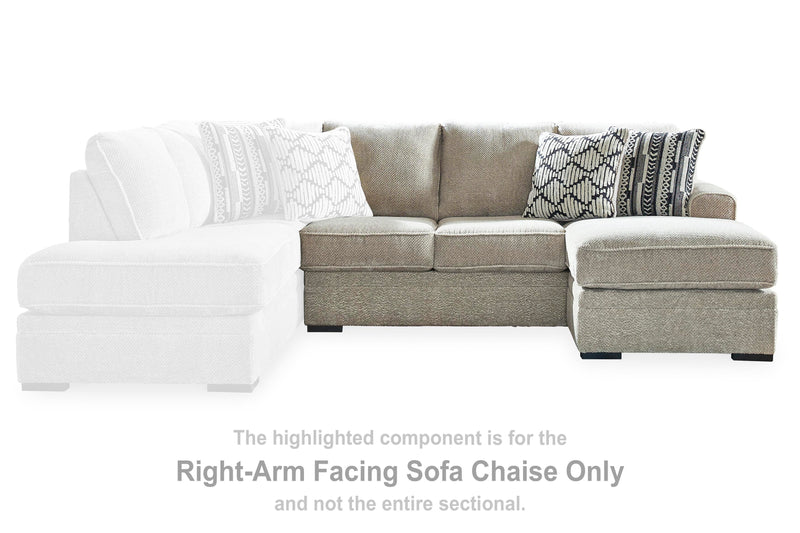 Ashley Furniture Calnita sectional with chaise, featuring plush fabric, modern design, and comfortable seating arrangement.