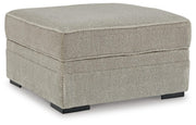 Ashley Furniture Calnita living room set featuring a sofa and loveseat with neutral fabric and modern design.