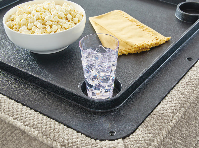 Ashley Furniture Calnita Ottoman with storage, showing a plush upholstered surface and built-in compartment for versatile use.