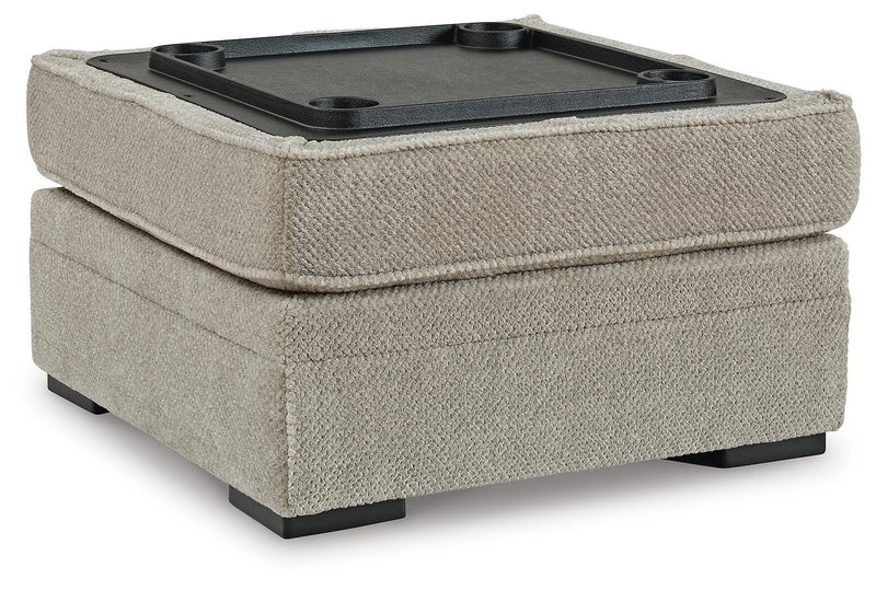 Ashley Furniture Calnita living room set with sofa, loveseat, and matching cushions, featuring cup holders and plush upholstery.