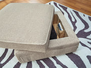 Ashley Furniture Calnita Ottoman with storage, featuring a cushioned top and wooden legs, ideal for living room organization.