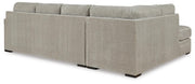 Ashley Furniture Calnita sectional with chaise, showing plush fabric and modern design, viewed from the back.