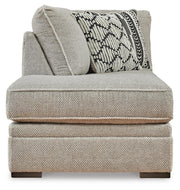 Ashley Furniture Calnita sectional with chaise showing plush fabric, modern design, and ample seating in a cozy living room setting.