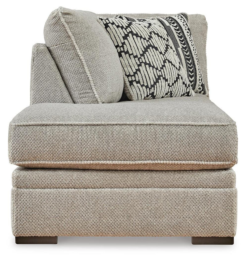 Ashley Furniture Calnita sectional with chaise showing plush fabric, modern design, and ample seating in a cozy living room setting.