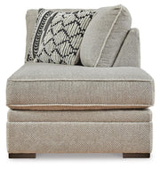 Ashley Furniture Calnita sectional with chaise, showcasing a modern fabric sofa with clean lines and plush cushions.