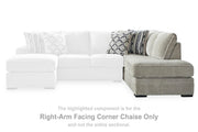 Ashley Furniture Calnita sectional with chaise, featuring plush cushions and contemporary design, shown in a modern living room setting.