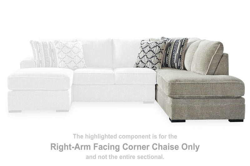 Ashley Furniture Calnita sectional with chaise, featuring plush cushions and contemporary design, shown in a modern living room setting.