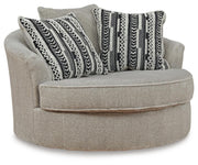 Ashley Furniture Calnita oversized swivel accent chair with plush upholstery and modern design, shown from an angled view.