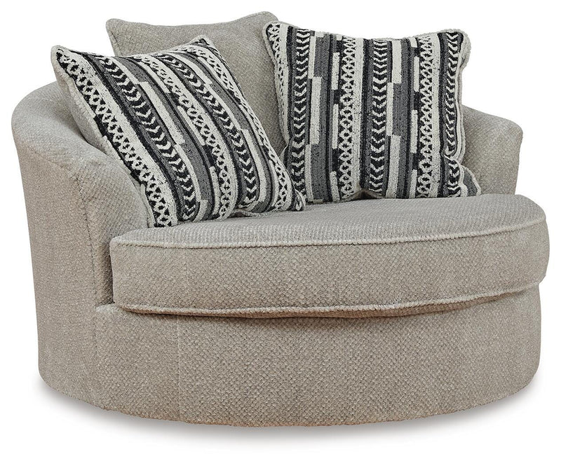 Ashley Furniture Calnita oversized swivel accent chair with plush upholstery and modern design, shown from an angled view.