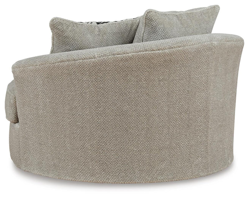 Ashley Furniture Calnita oversized swivel accent chair with plush upholstery and modern design, shown from the back.
