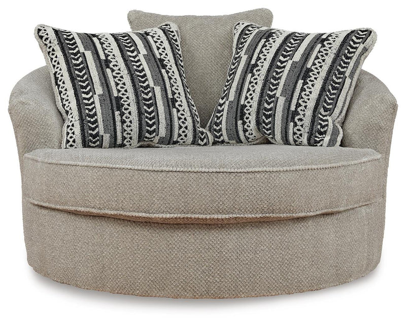 Ashley Furniture Calnita oversized swivel accent chair with plush fabric and modern design, shown from front view.