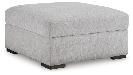 Ashley Furniture Gabyleigh Ottoman with storage, featuring a plush upholstered seat and wooden legs in a modern design.