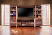 Antique multicolor wood entertainment center wall unit by International Furniture Direct with shelves and storage compartments.