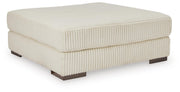 Ashley Furniture Lindyn living room set featuring a stylish sofa and loveseat with neutral upholstery and modern design.