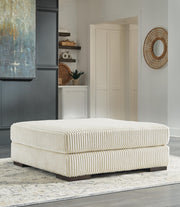 Ashley Furniture Lindyn living room set featuring a sofa and loveseat with plush cushions and modern design in neutral fabric.