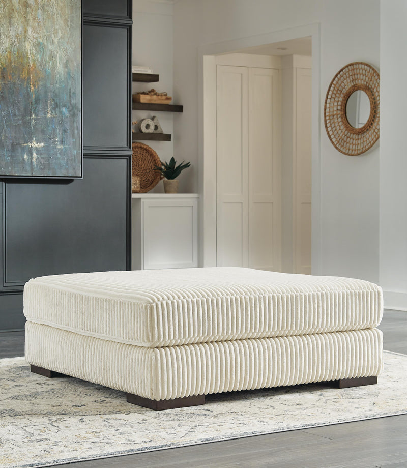 Ashley Furniture Lindyn living room set featuring a sofa and loveseat with plush cushions and modern design in neutral fabric.