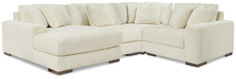Ashley Furniture Lindyn sectional with chaise, showing plush fabric upholstery and a modern L-shaped design in a living room setting.