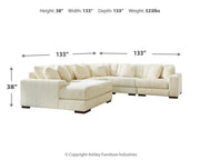 Ashley Furniture Lindyn living room set featuring a sofa and armchair with neutral upholstery and modern design.
