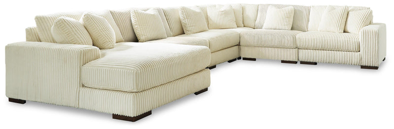 Ashley Furniture Lindyn living room set with plush sofa, loveseat, and armchair in modern fabric upholstery.