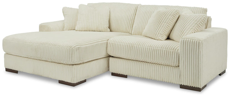 Ashley Furniture Lindyn sectional with chaise, featuring plush fabric upholstery and modern design for comfortable living space.