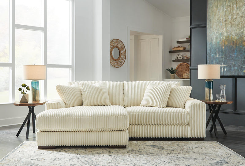 Ashley Furniture Lindyn sectional with chaise, featuring plush upholstery and modern design in a cozy living room setting.
