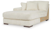 Ashley Furniture Lindyn sectional with chaise, showing a modern fabric sofa with a spacious L-shaped design and plush cushions.