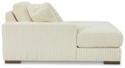 Ashley Furniture Lindyn sectional with chaise, featuring plush fabric upholstery and modern design, shown in a living room setting.