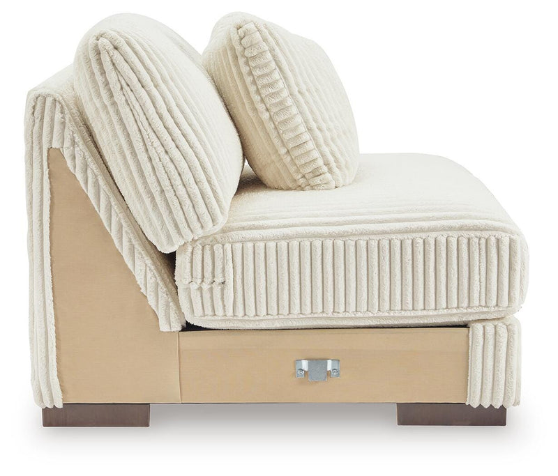 Ashley Furniture Lindyn sectional with chaise in neutral upholstery, showing the spacious seating and modern design.
