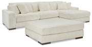 Ashley Furniture Lindyn living room set with a sofa and matching armchair in a modern design, featuring neutral-toned upholstery.