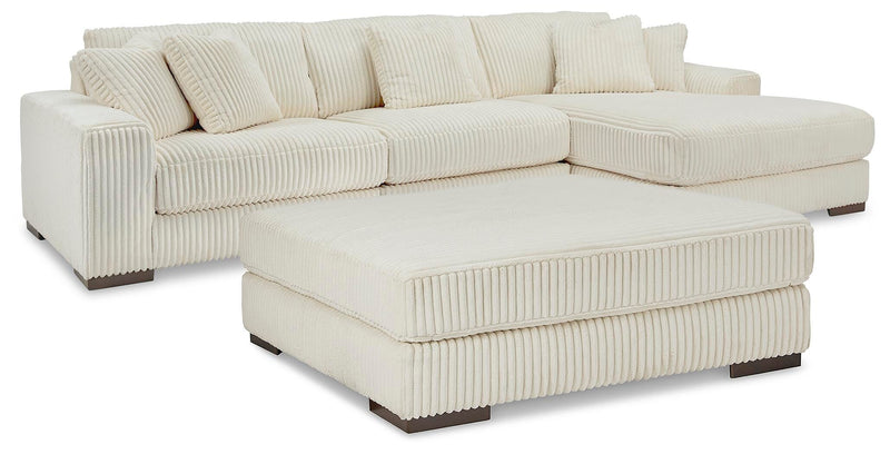 Ashley Furniture Lindyn living room set with a sofa and matching armchair in a modern design, featuring neutral-toned upholstery.